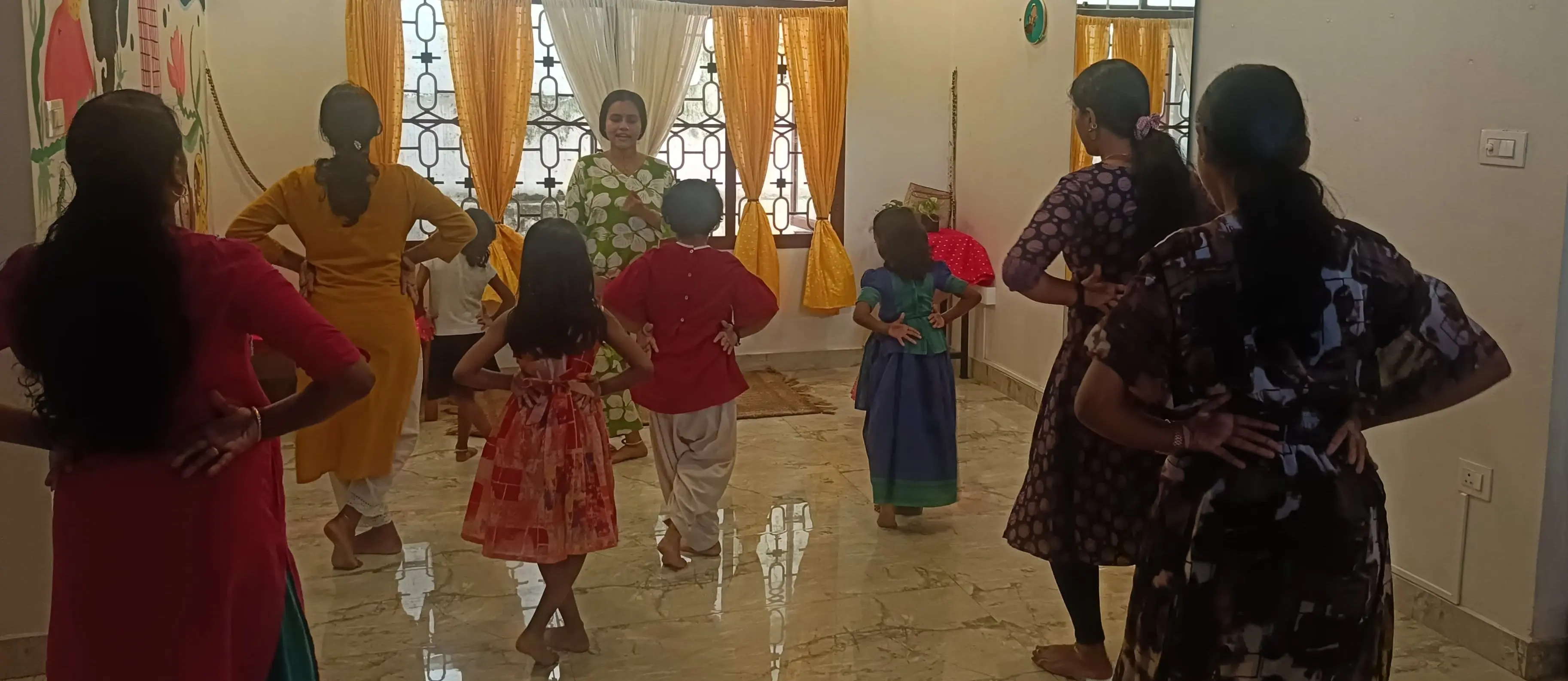 Dance students move into adavu and mudra practice